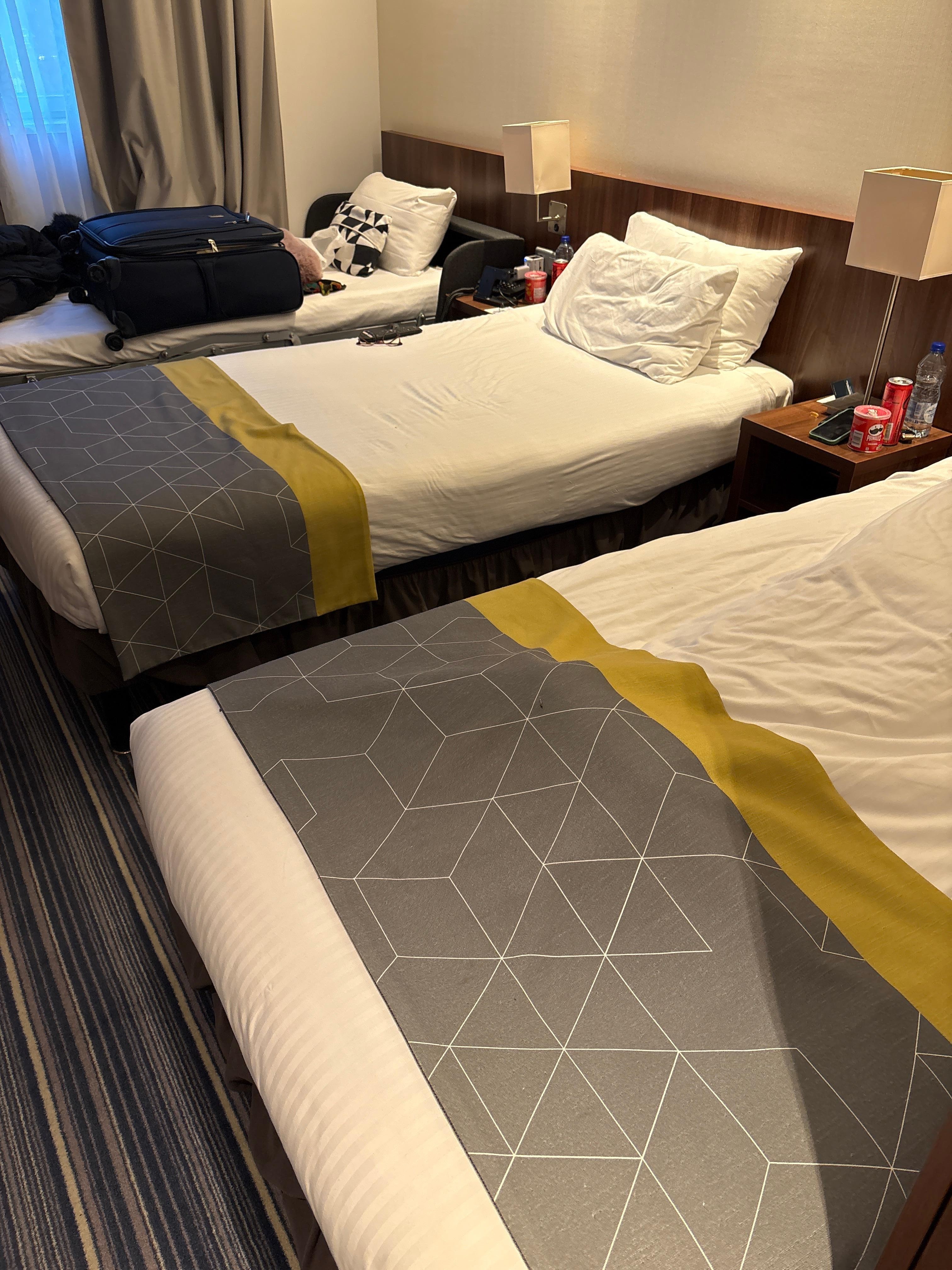 2 single beds with a cot.