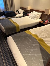 2 single beds with a cot.