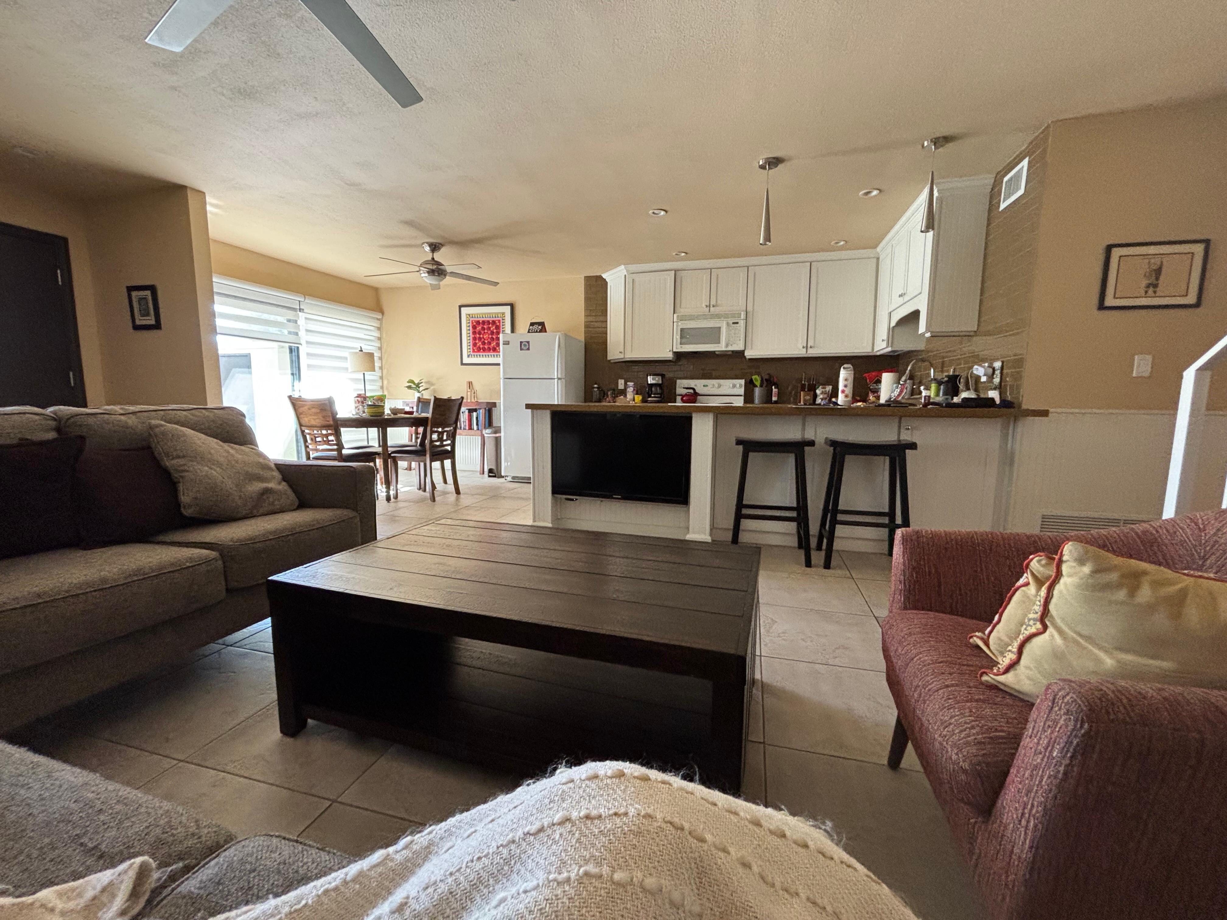 View from couch looking at kitchen and dining area. Stools at the counter were great for breakfast and coffee. 