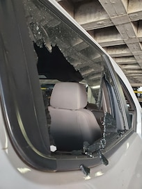 Vandalized back passenger window, exterior view
