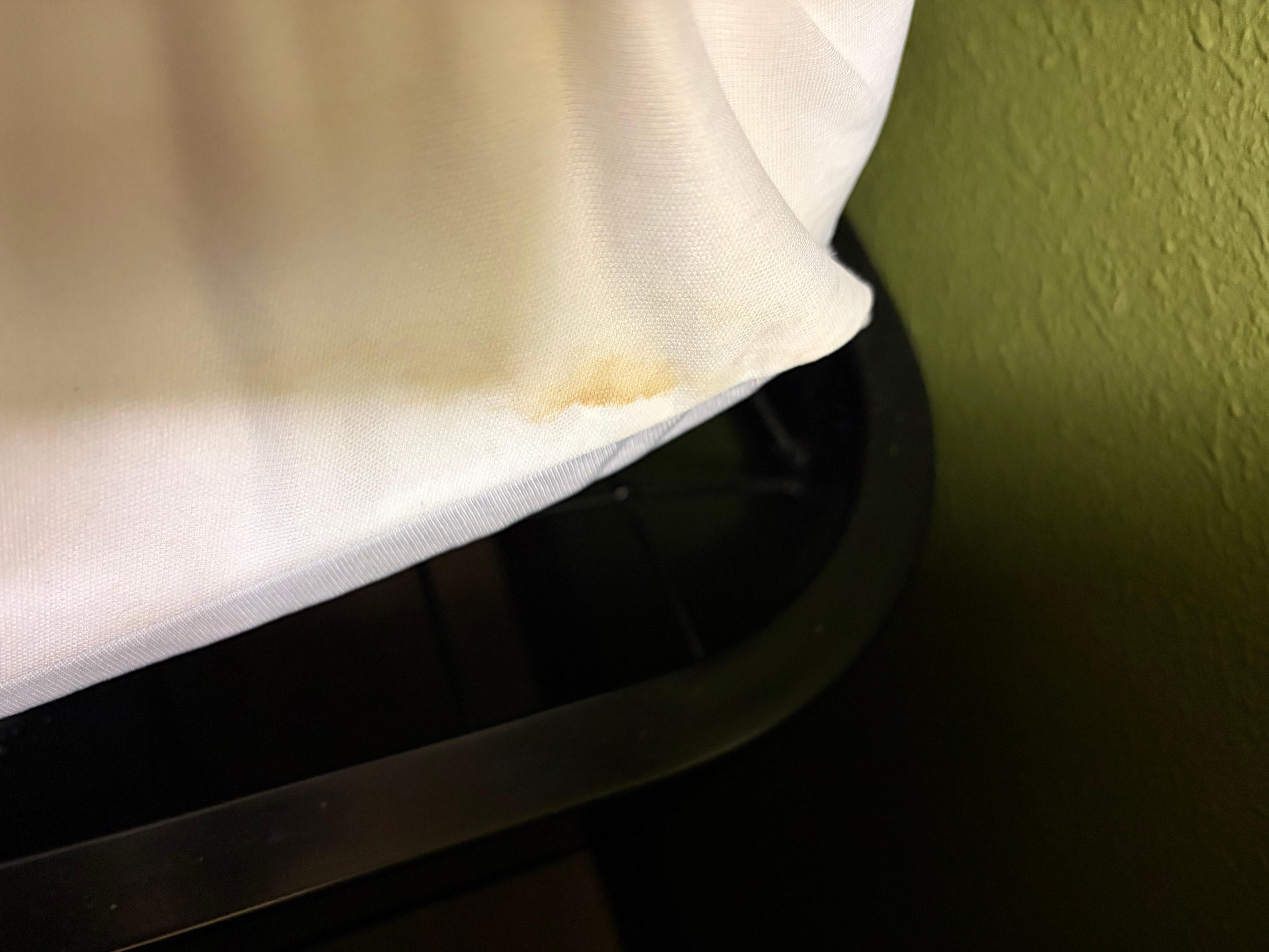 Stain on mattress cover.