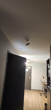 Fire alarm dangling by it's wires and kickboard falling off the walls