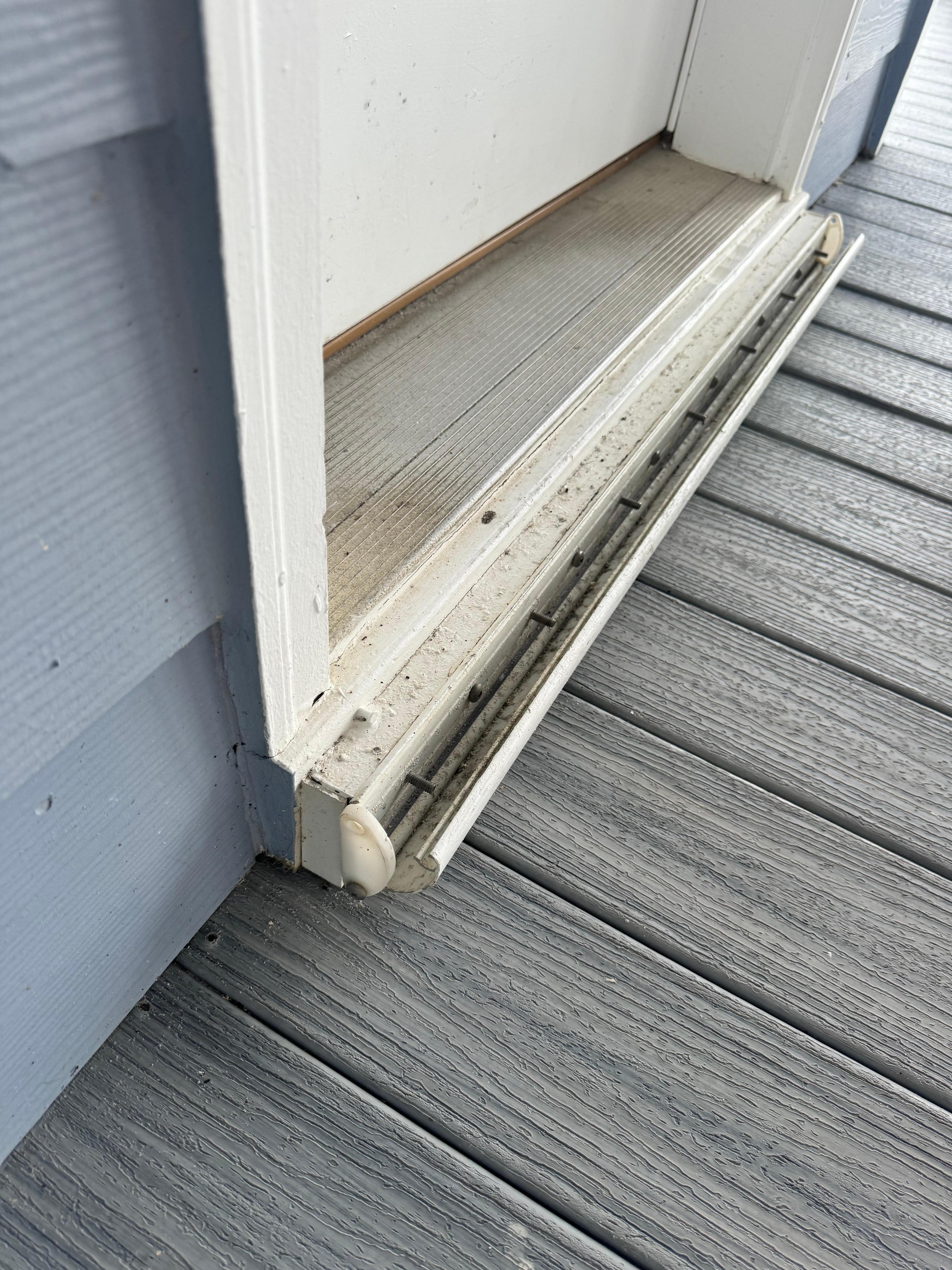 This piece at the bottom of the frame would fall off every time someone went out on the deck. Exposed screws could be dangerous for little kids. 