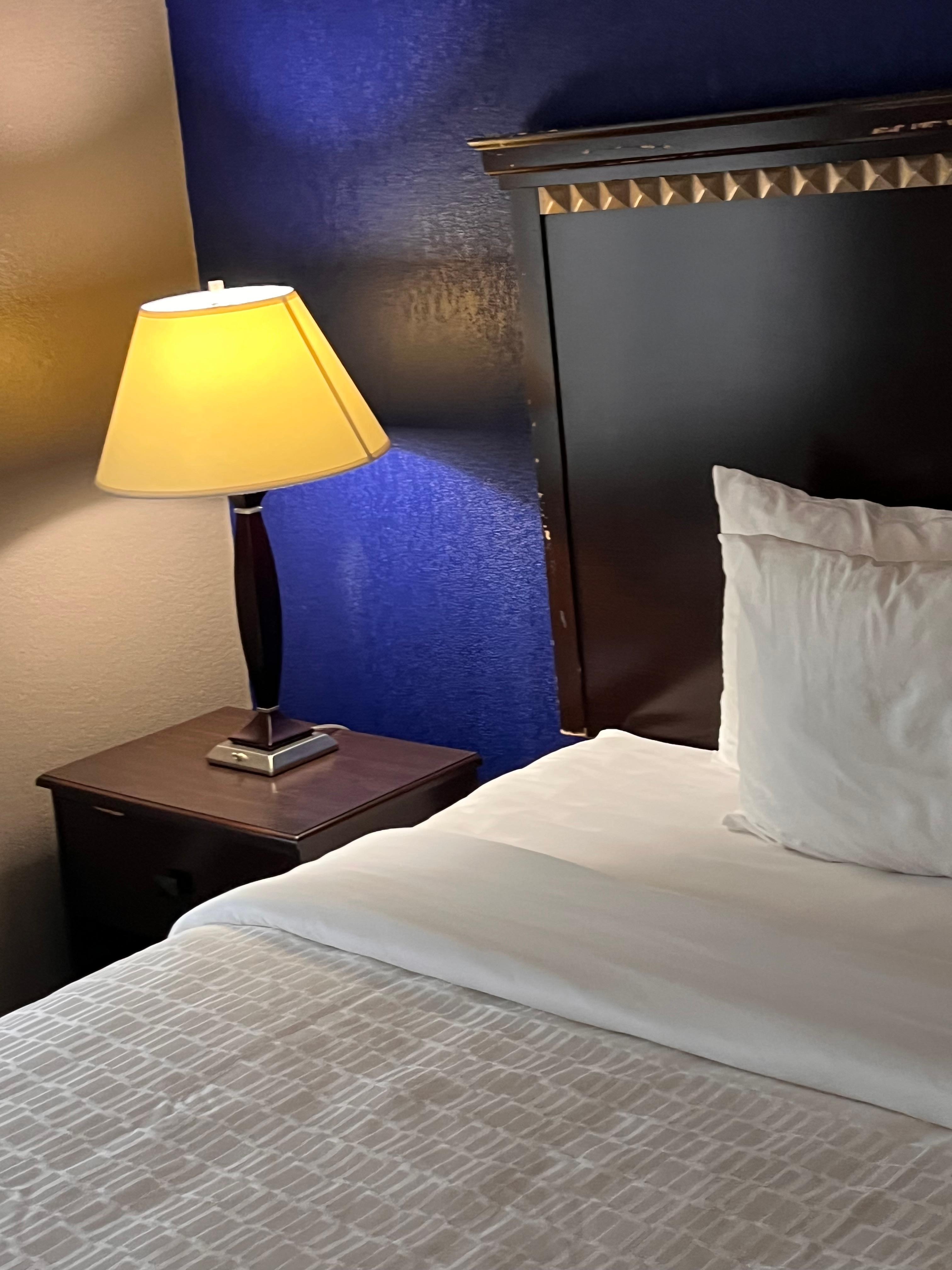 Side of bed with in table and lamp