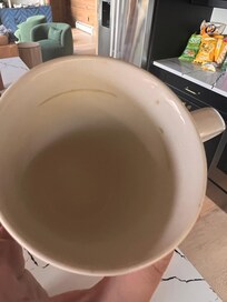 Dirty mug in cabinet