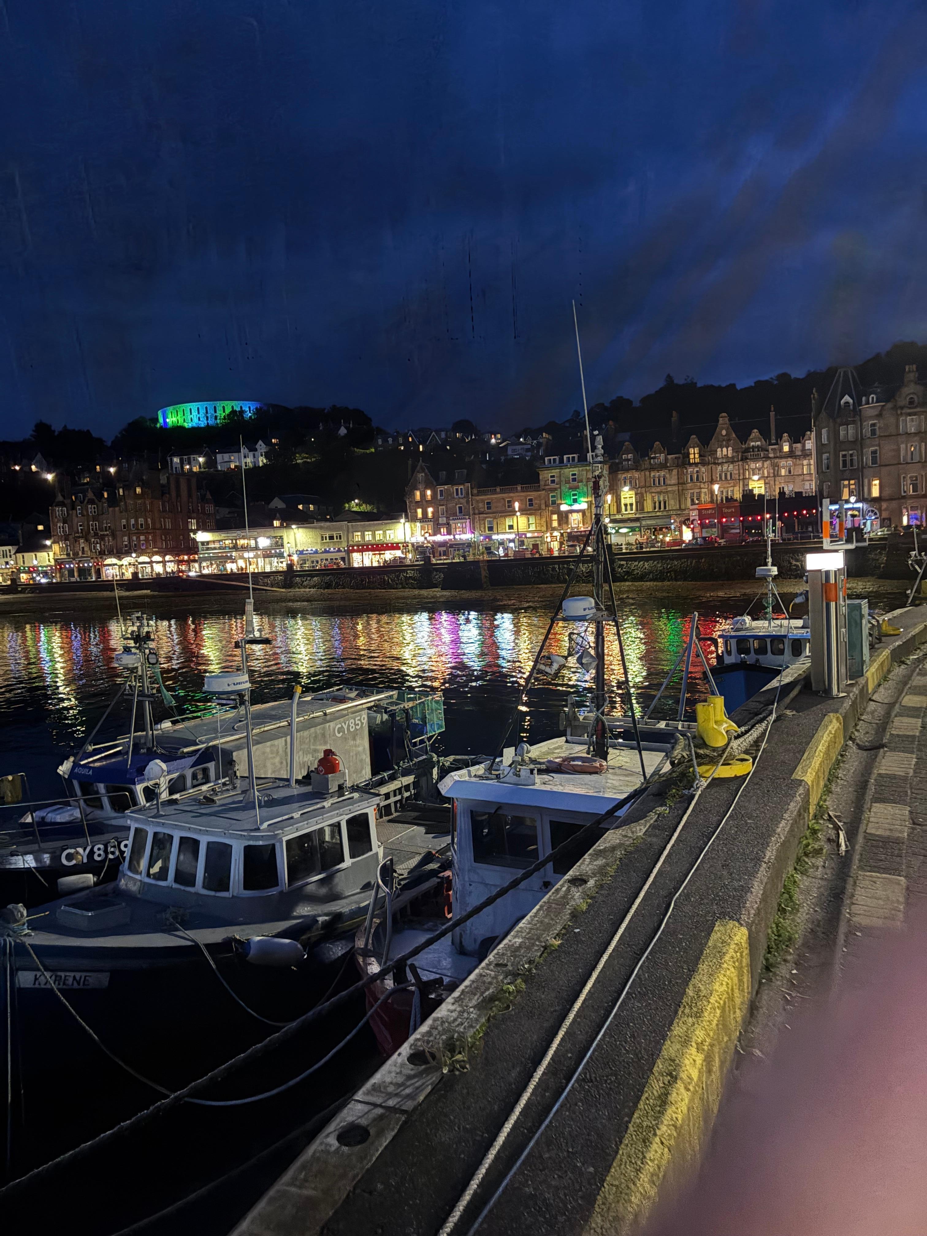 A shot of the city from the harbor at night. 