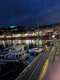 A shot of the city from the harbor at night.