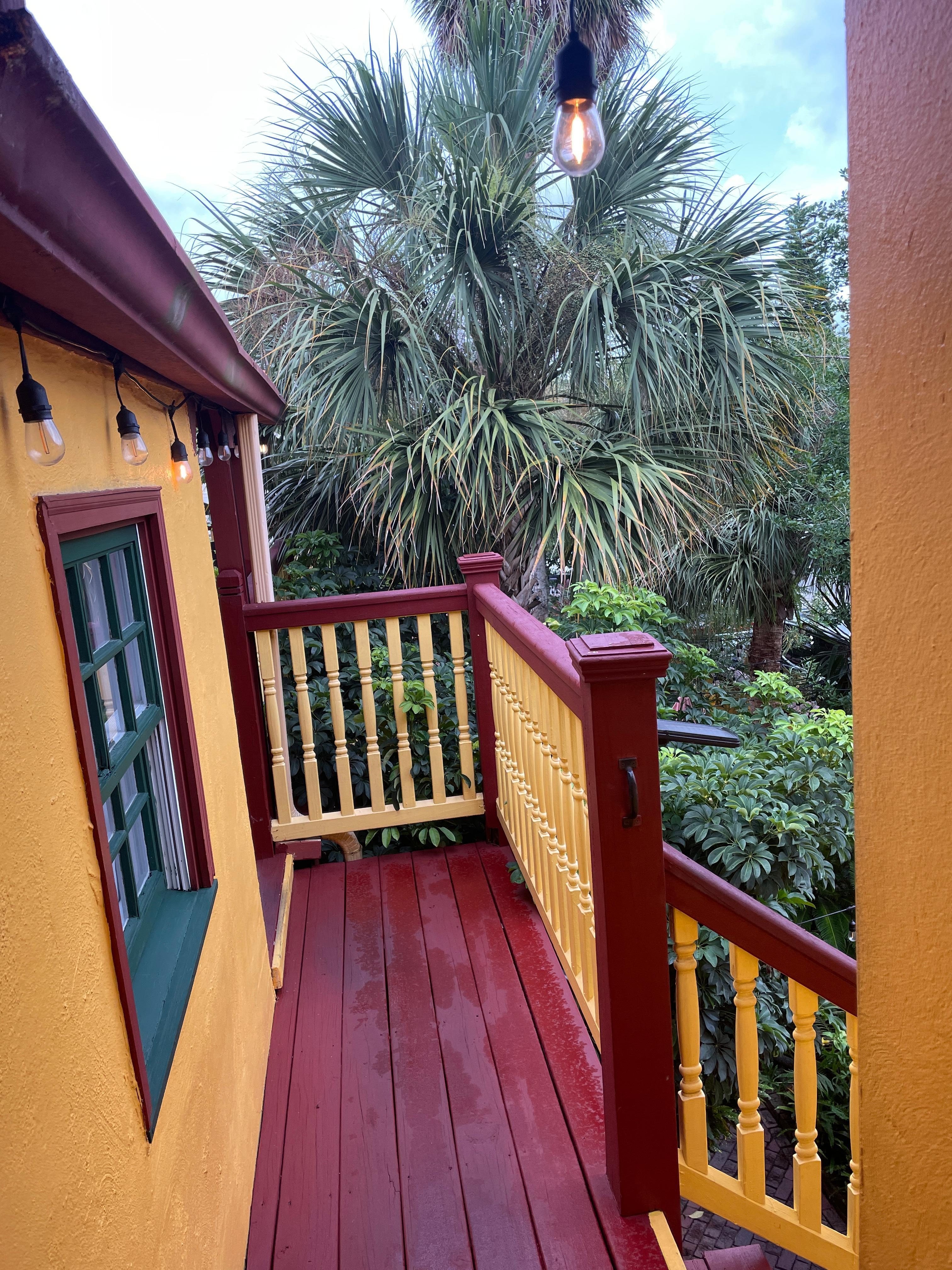 Walkway to room from top of stairway