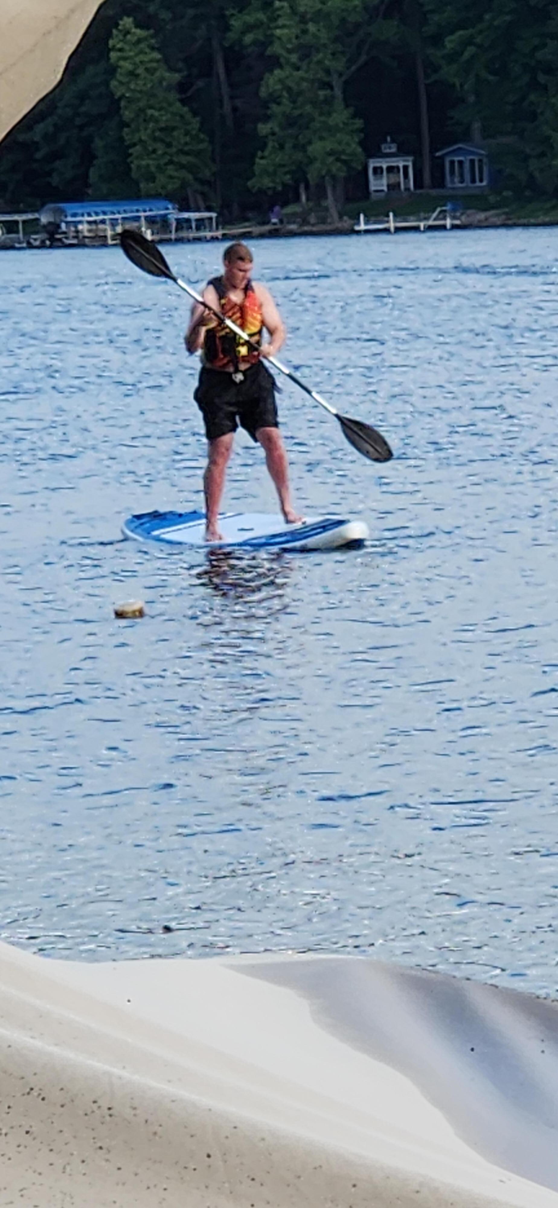 Enjoying the paddle board provided!  It was great fun!
