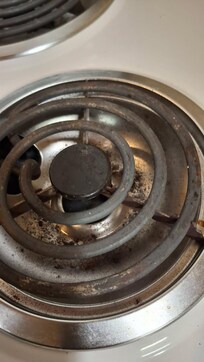 Grease and grim under the burners on the stove
