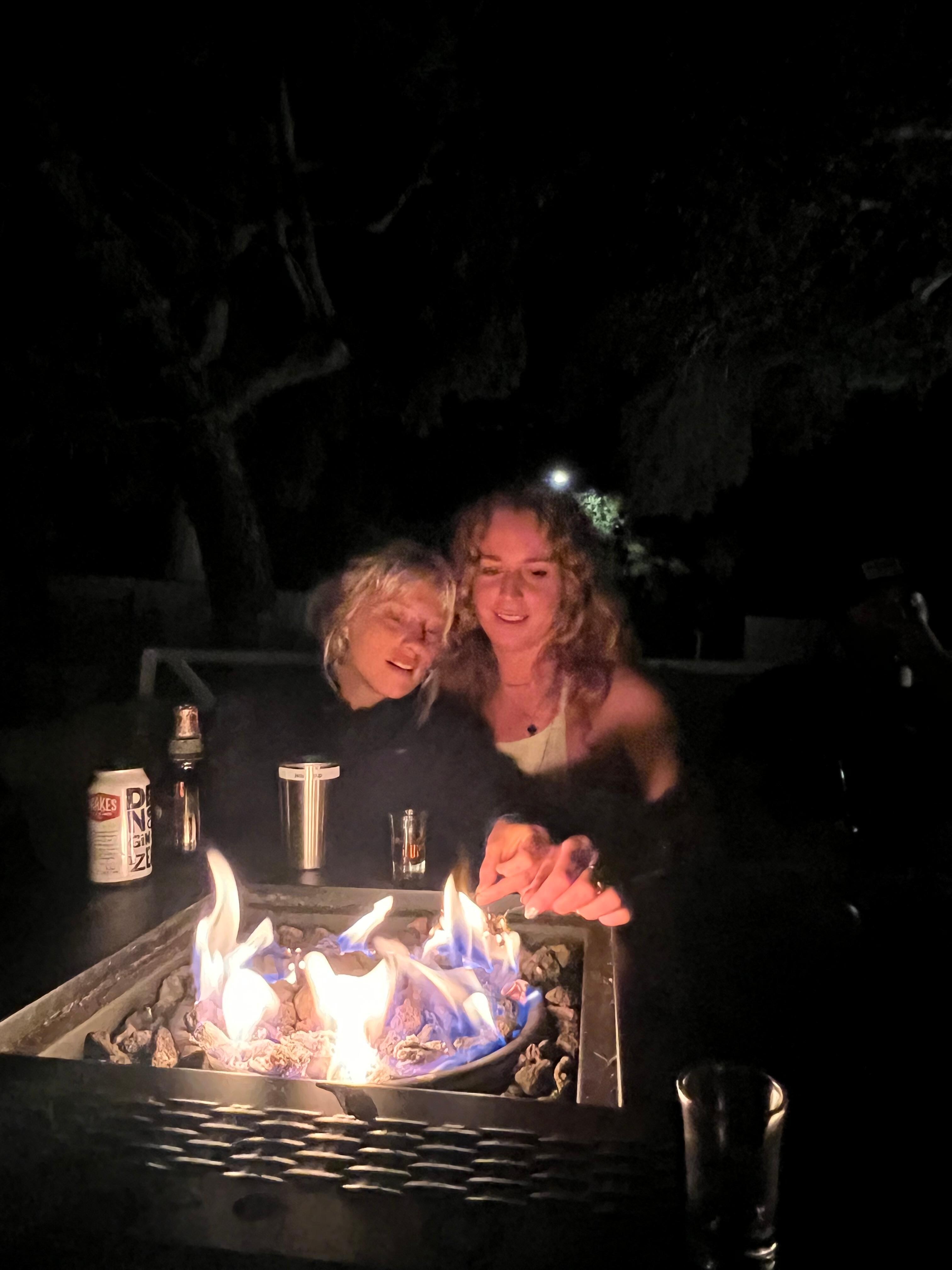 College friends enjoying the fire pit