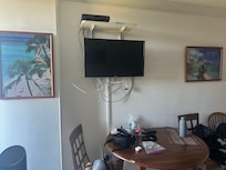 Small TV with wires everywhere.