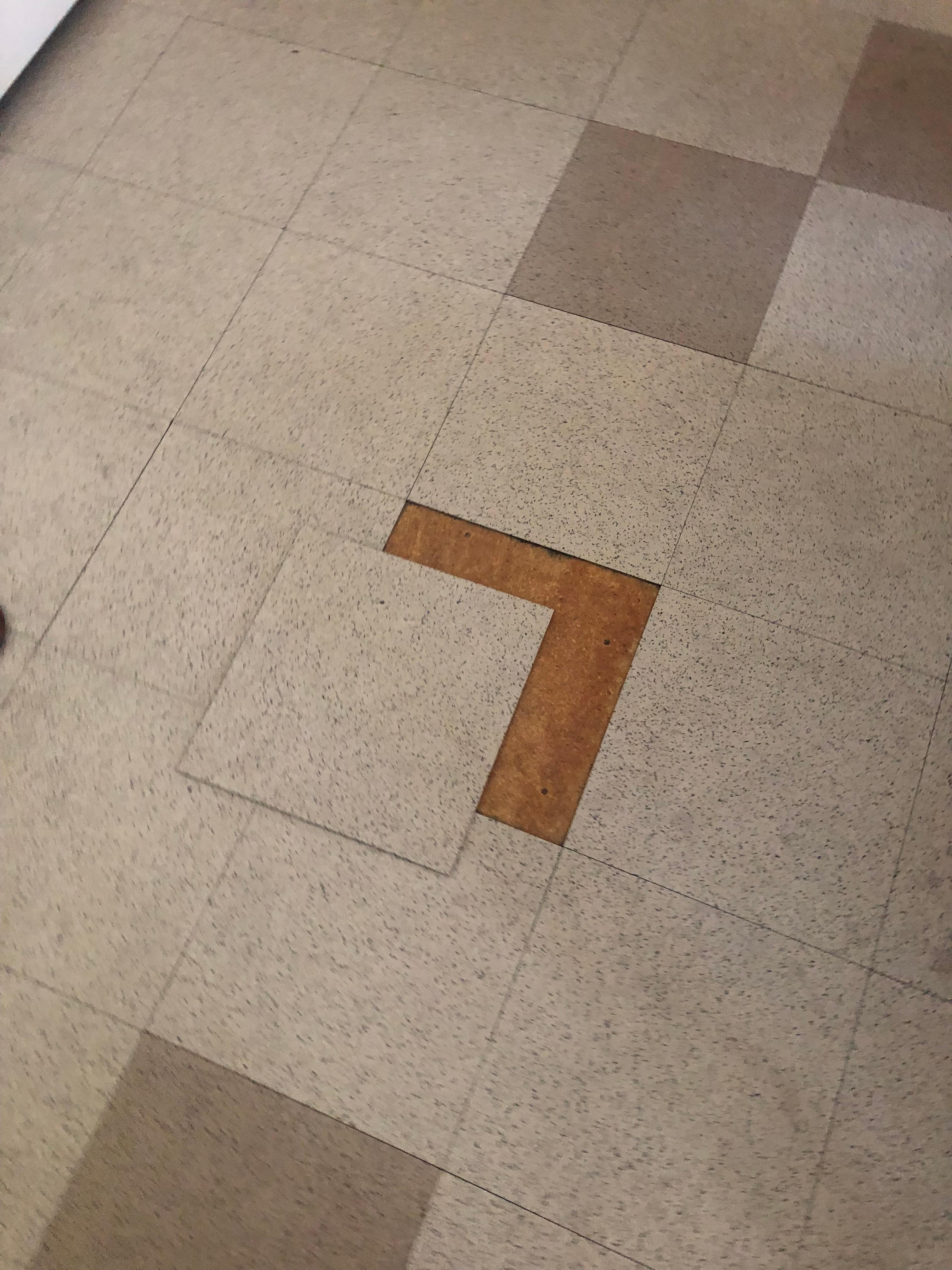 Removable floor tiles