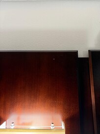 Roach at the top of the bedframe.