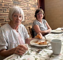 Lovely dining area, lots of kitchen equipment, cutlery, cups and glasses.