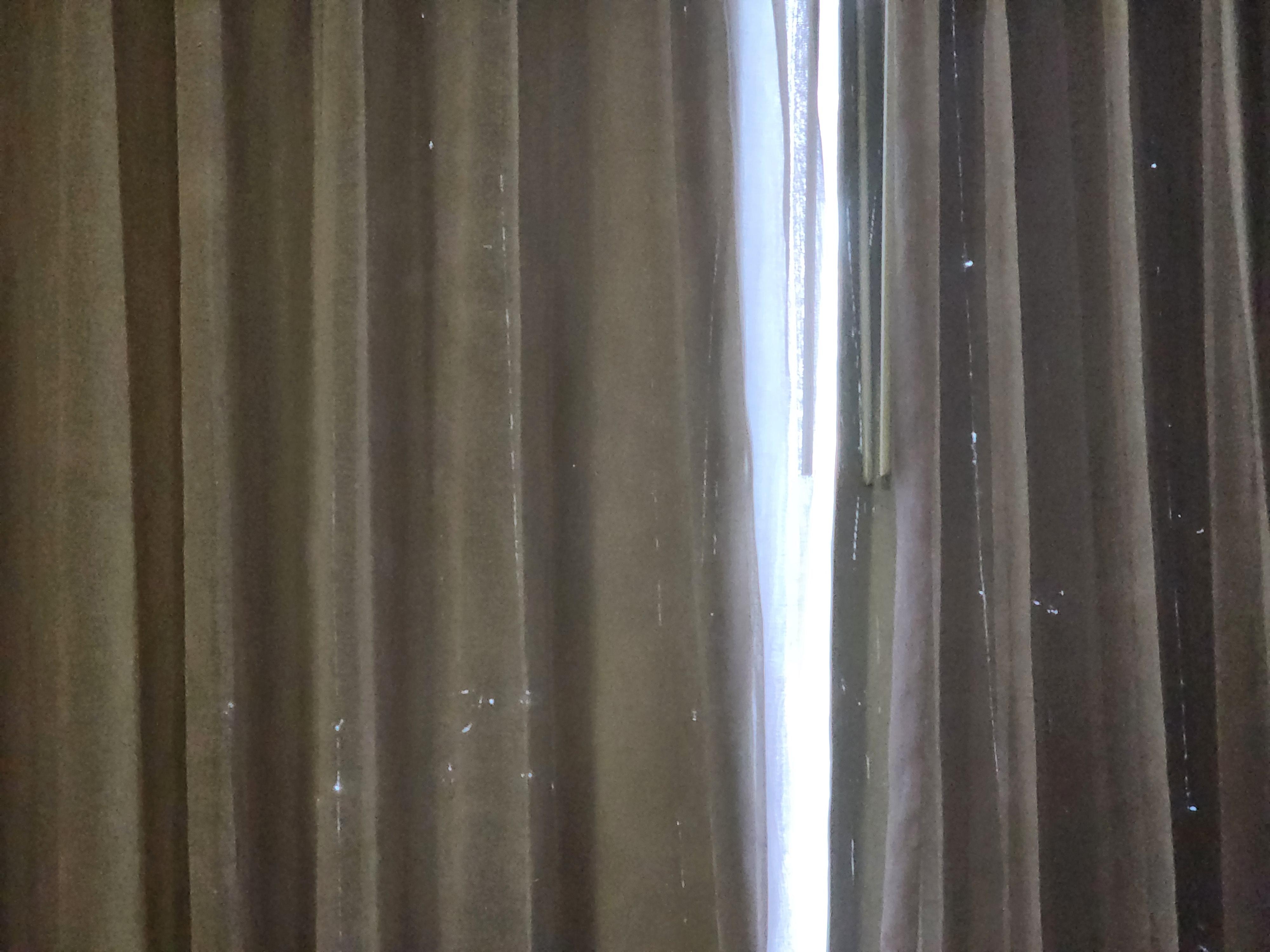 The blackout curtains had holes in them. The room was dingy