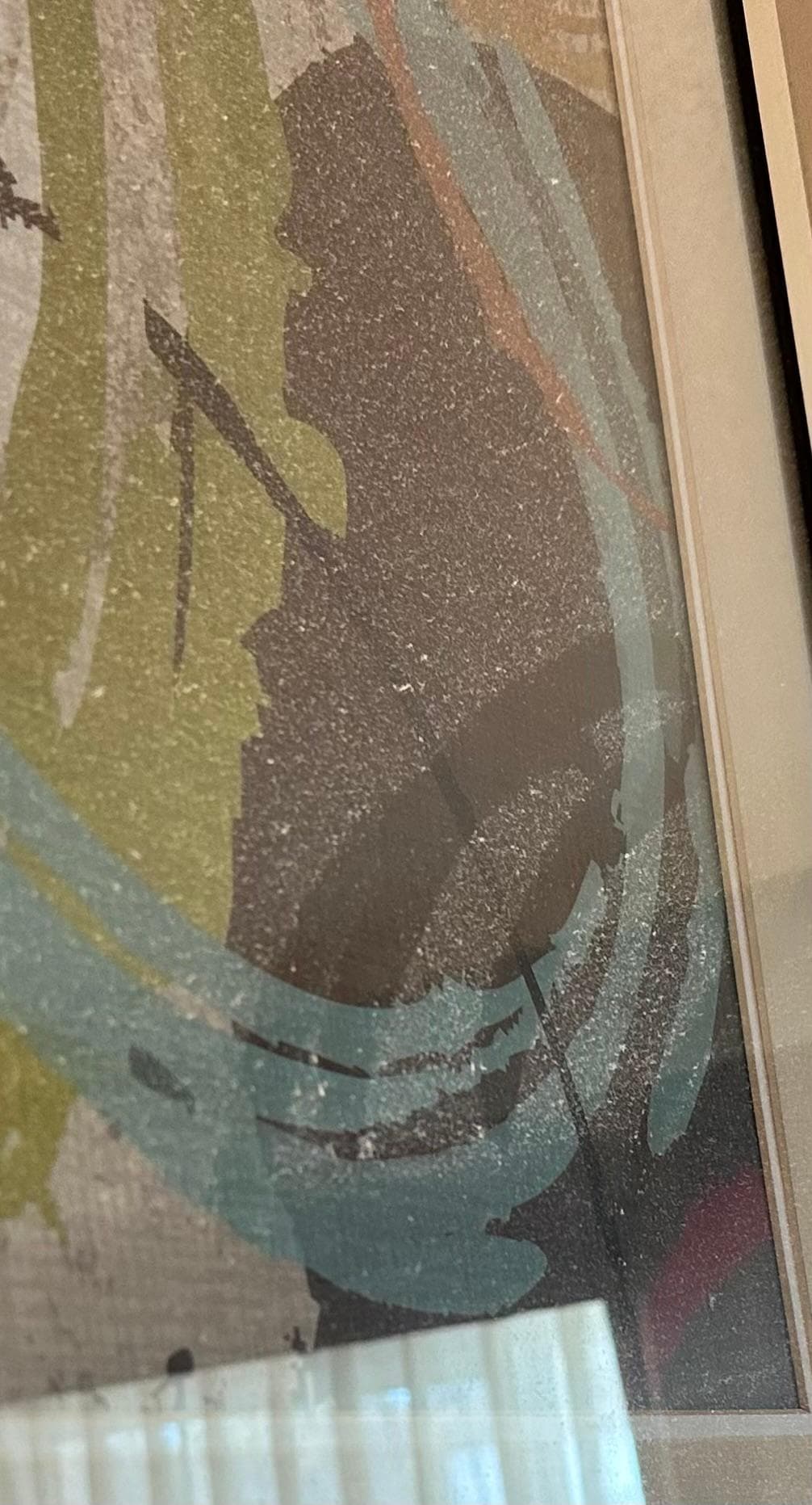 The dust coating on the wall picture