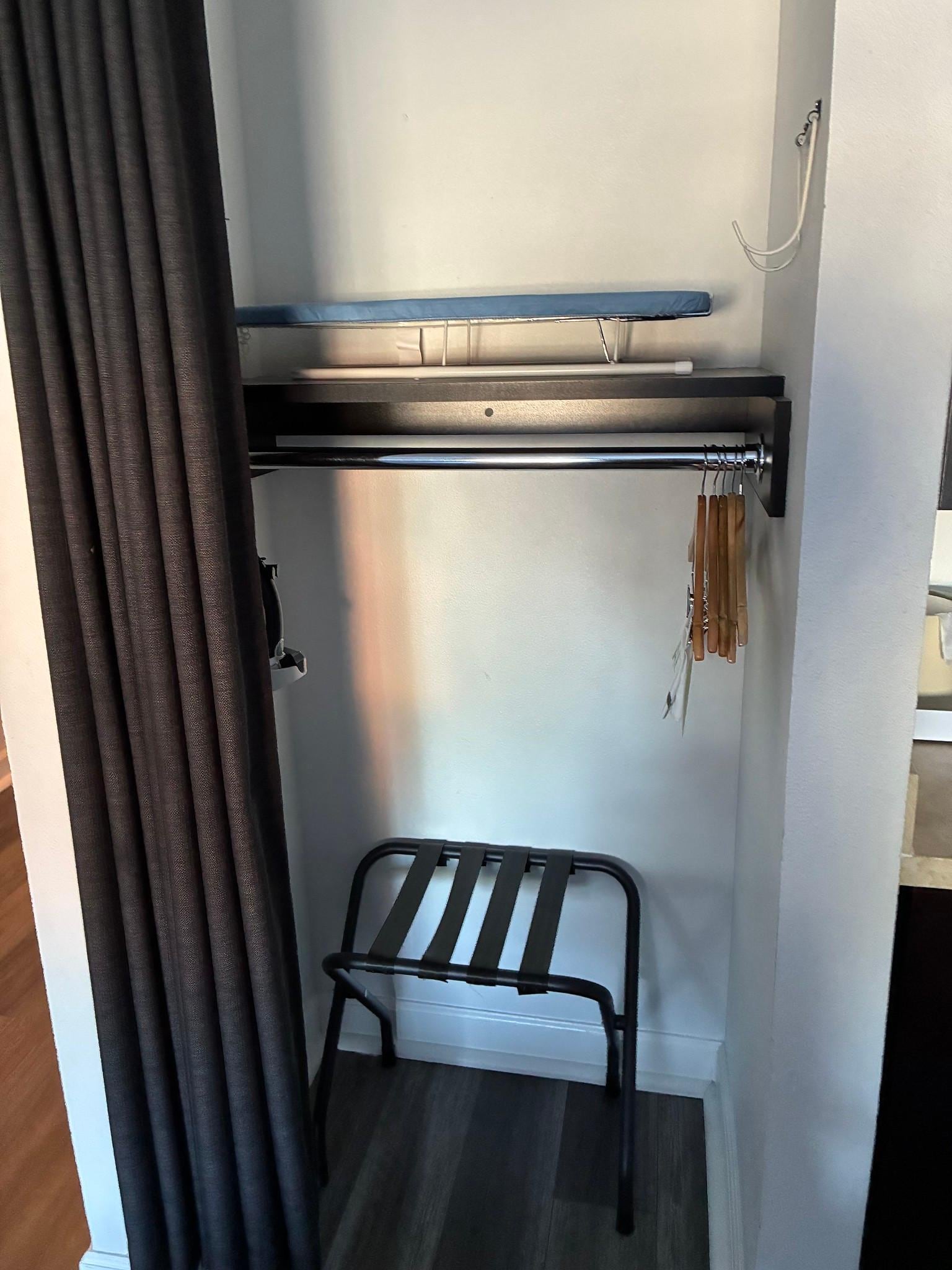 Ironing board and iron in closet