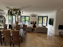Cozy yet very spacious living room (doors on two sides allow warm breezes!)