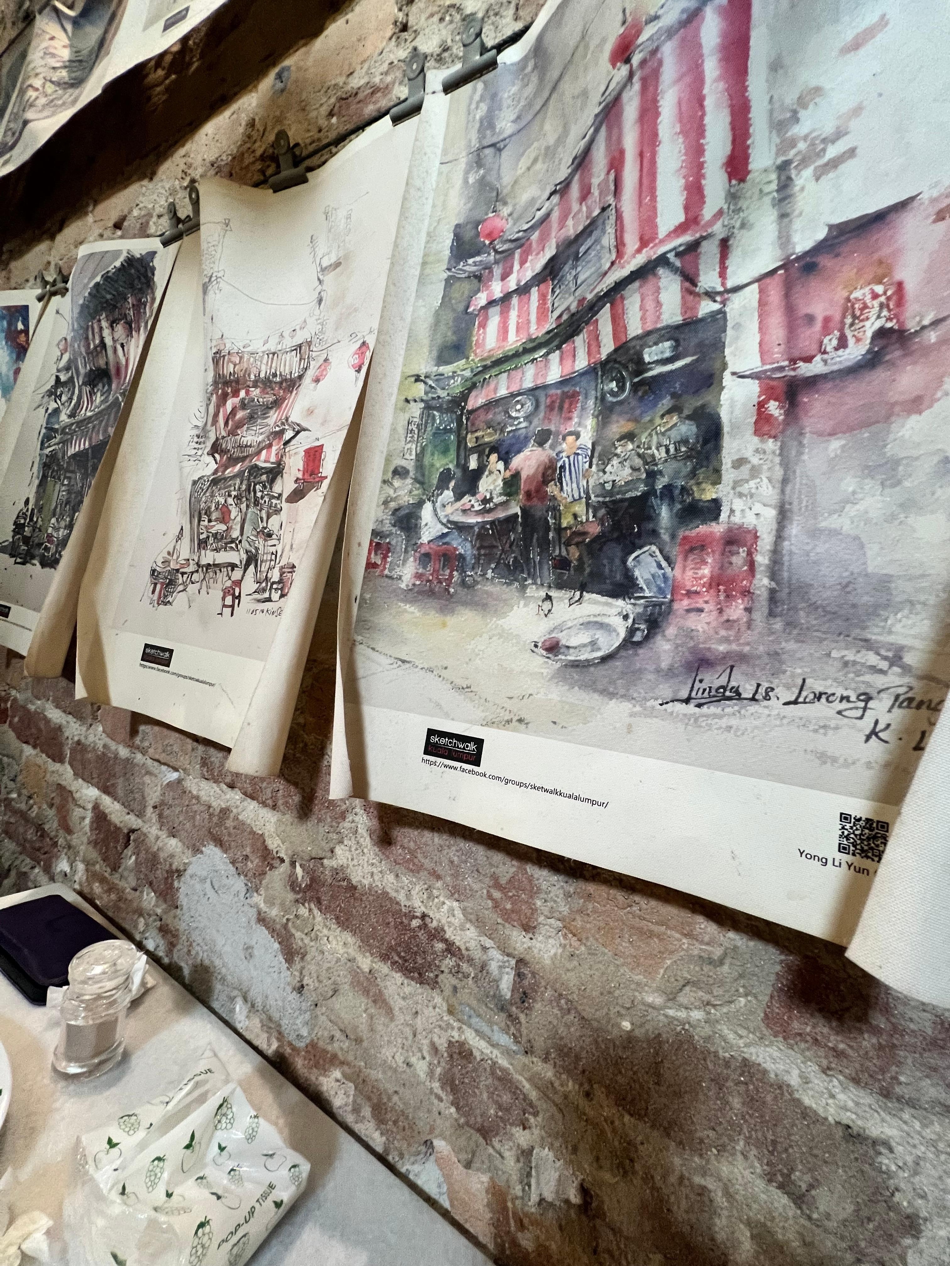 お店をモチーフにした壁に飾られた絵です。