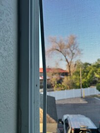 Crooked window screen room 202