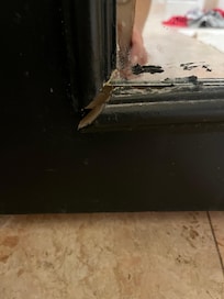 Broken trim around full length mirror