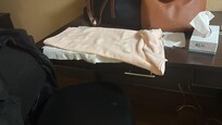 My makeshift bed with personal towel spread on the table
