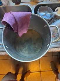 Pot under the sink because disposal was leaking