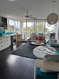 View the length of the living area to balcony.