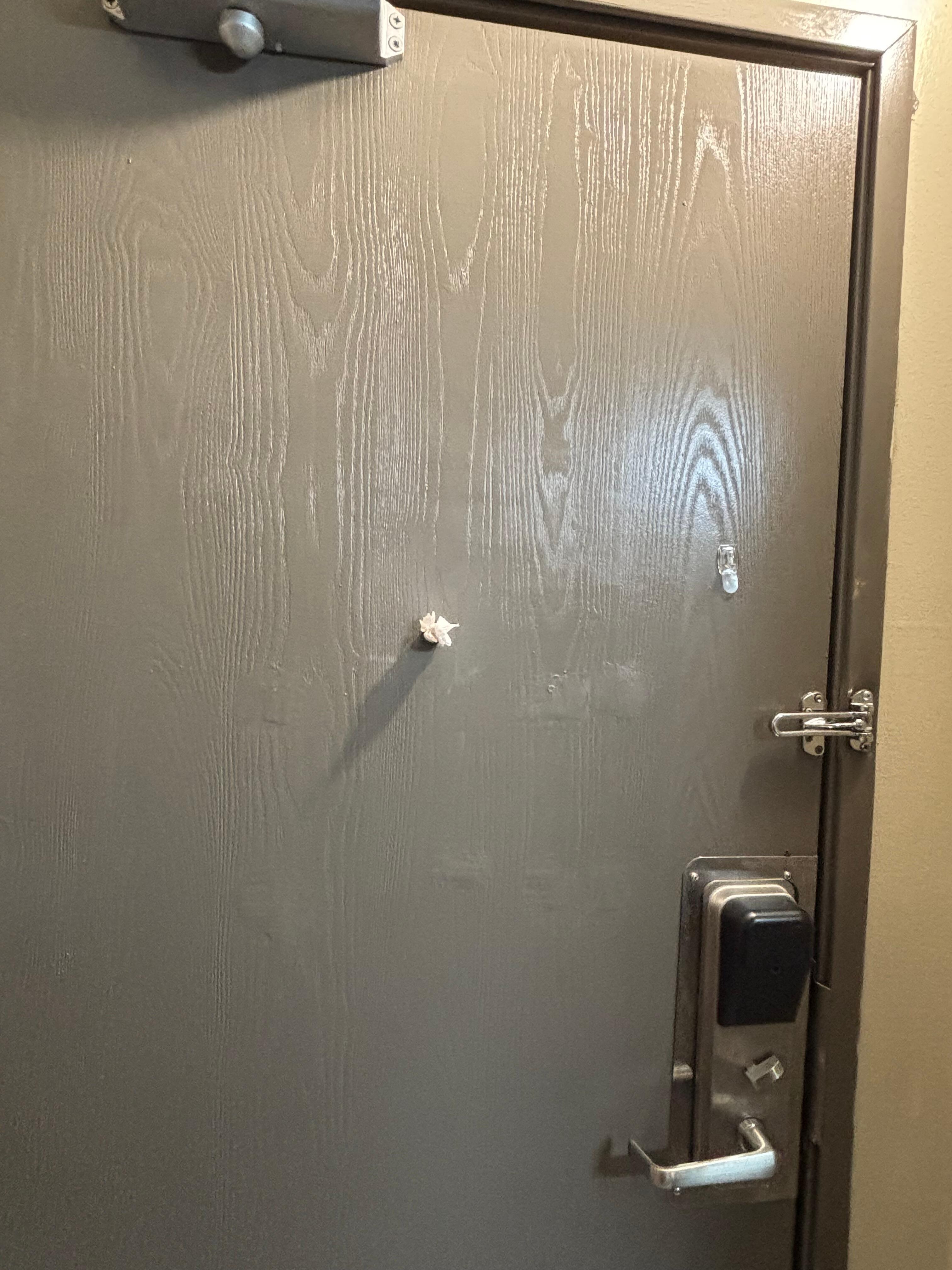 Someone else’s tissue stuffed into the peephole of the door. 