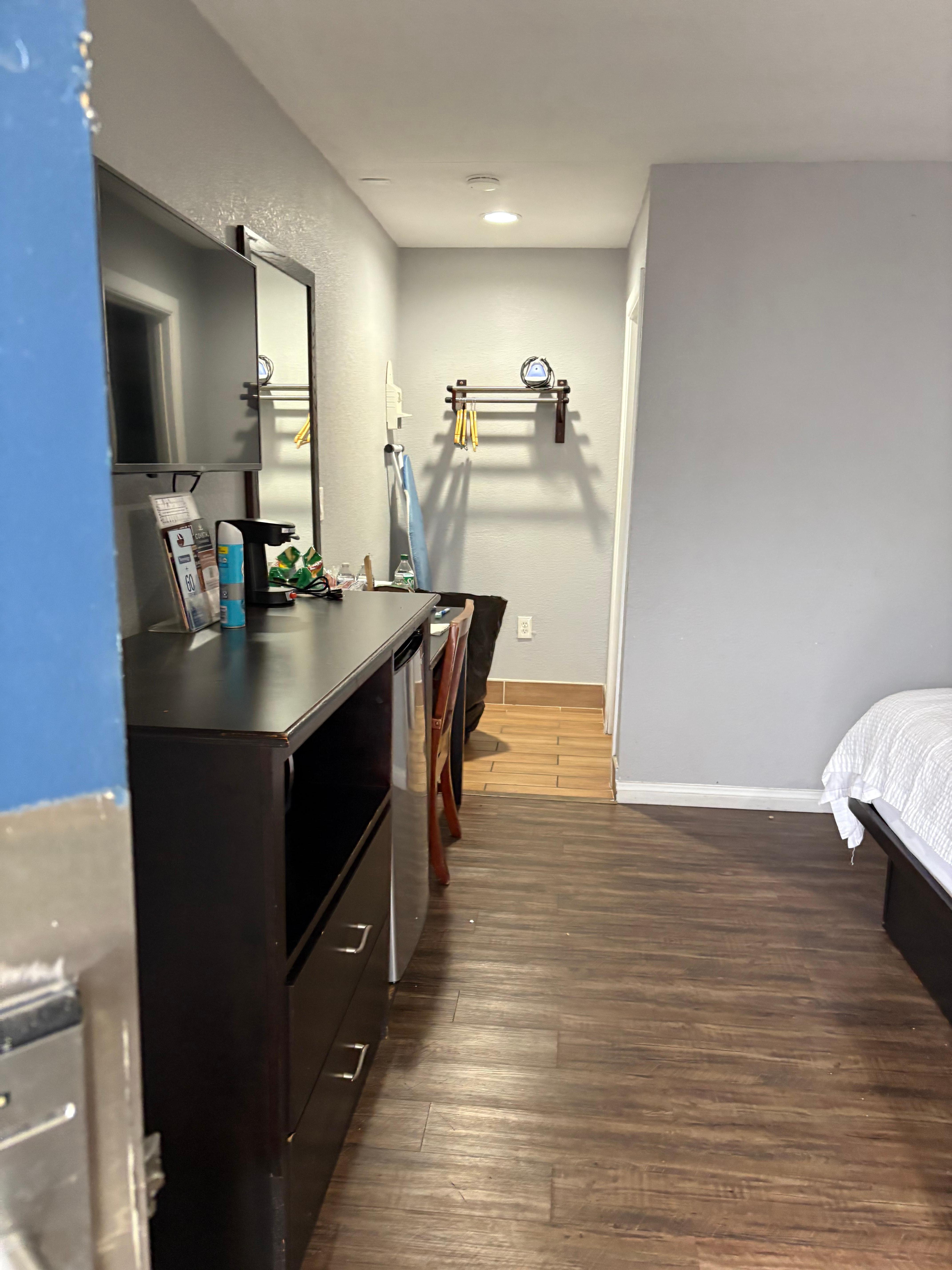This was dresser, desk, tv, hallway towards bathroom in king bedroom 