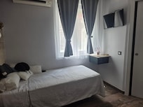 Cute little room also has a TV.