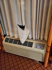 Large hole/tear in curtain. Spoke with the front desk. They said they were aware