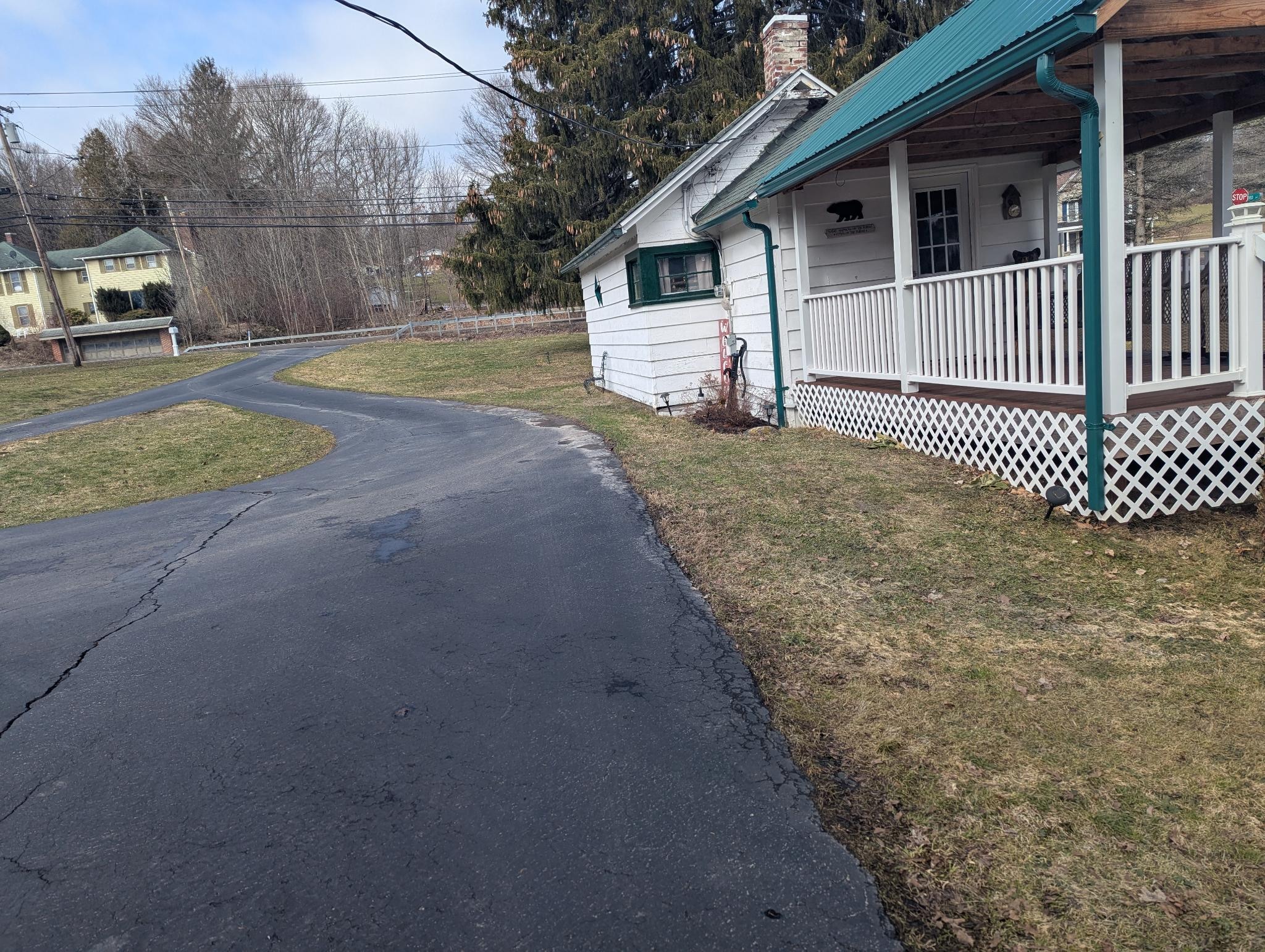 A driveway loop between the house and the cabin makes for easy entrance and exit for parking.