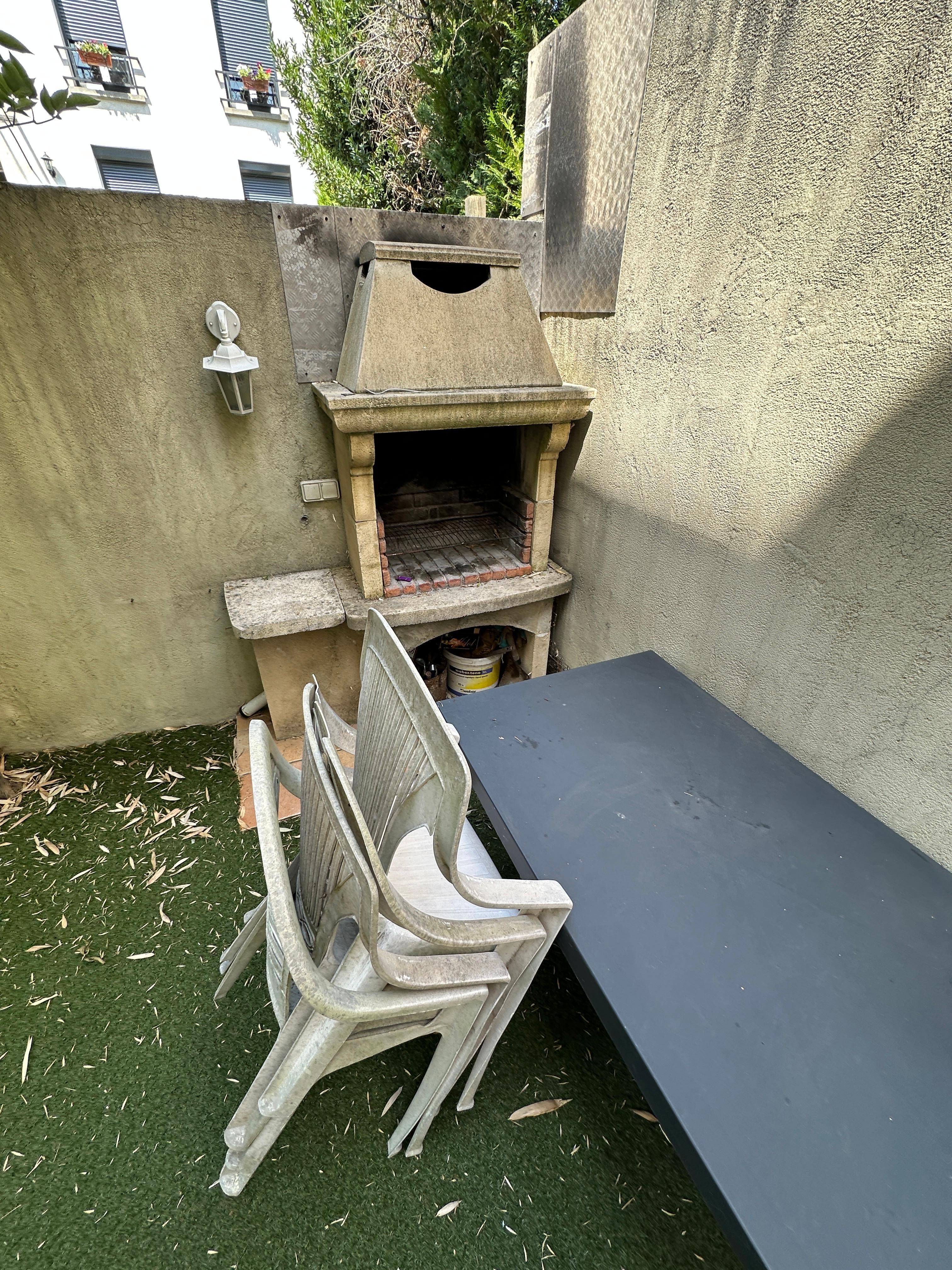 Patio seating. Grass was turf, no flowers or covering. 