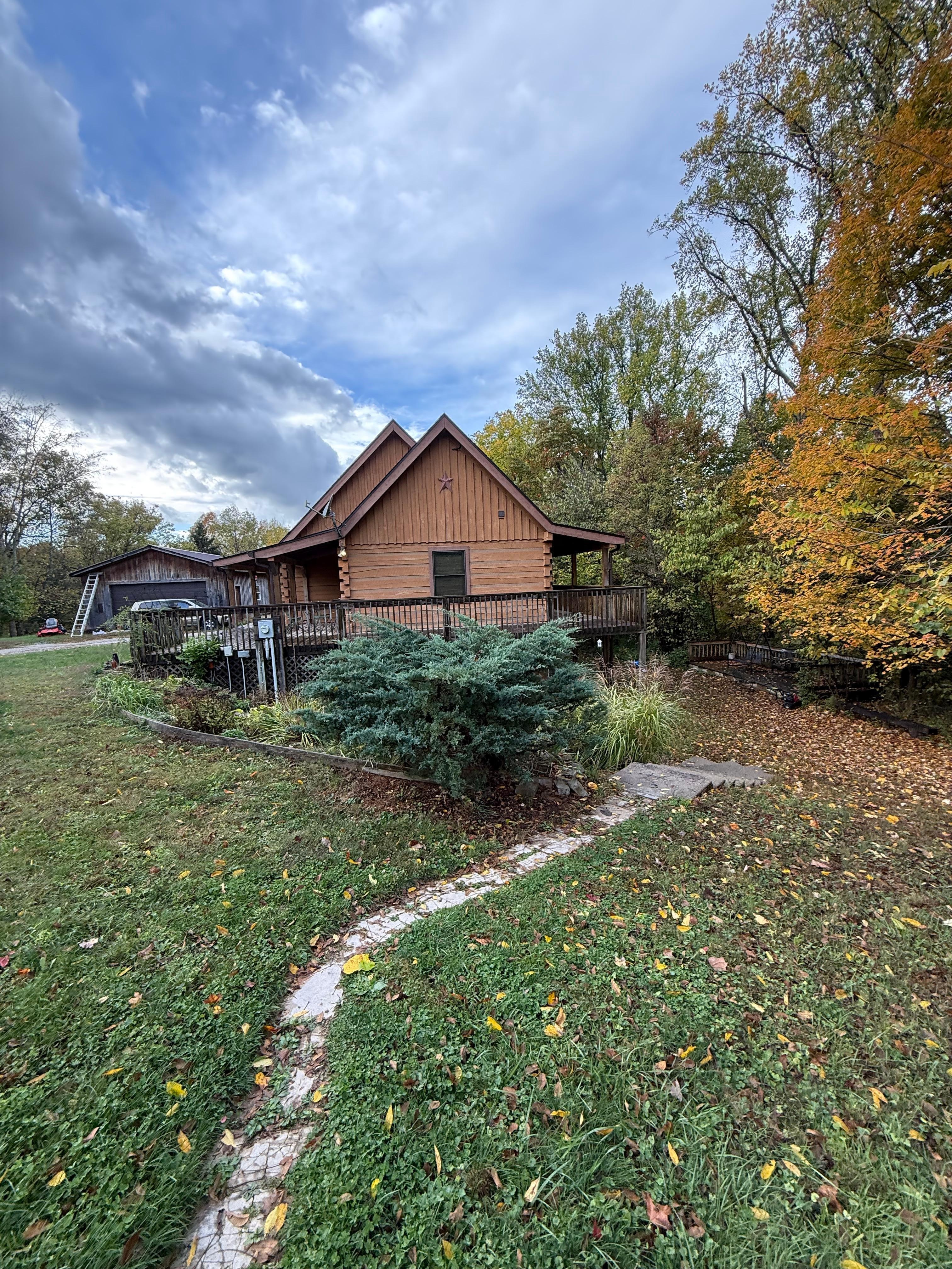 View of cabin from parking area. Guests take walkway to the lower level in back. 