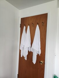 Used towels on back of bedroom door