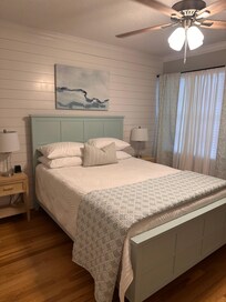 Guest Queen bed next to the bathroom.