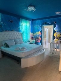 1st Floor Master Bedroom with crib.