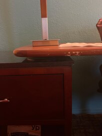 Desk by red chair by door