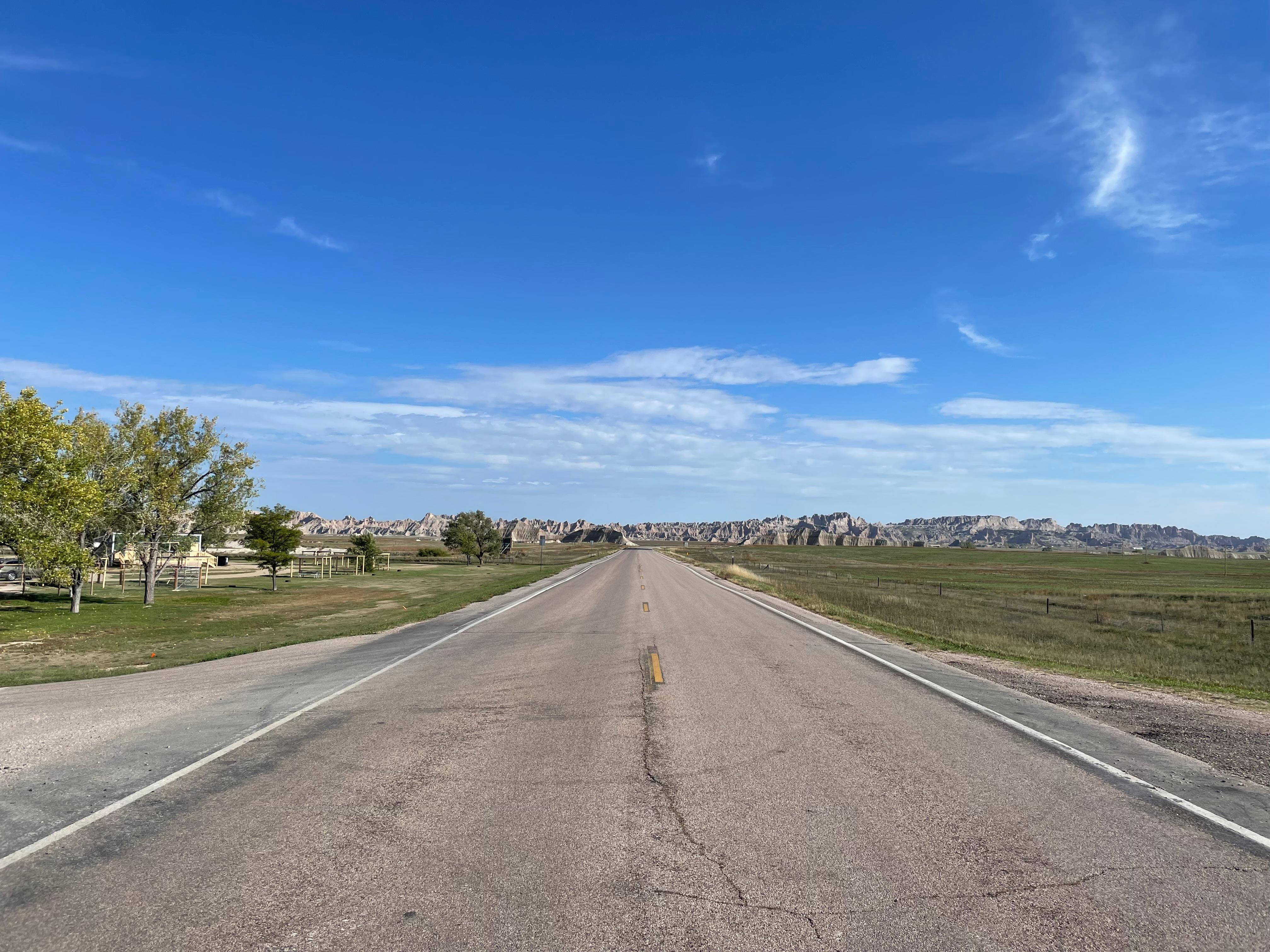 View from camp entrance with Badlands at the end of this road.