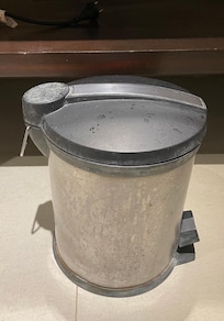 Disgustingly dirty trashcan for the bathroom with rust. Furniture was even worse