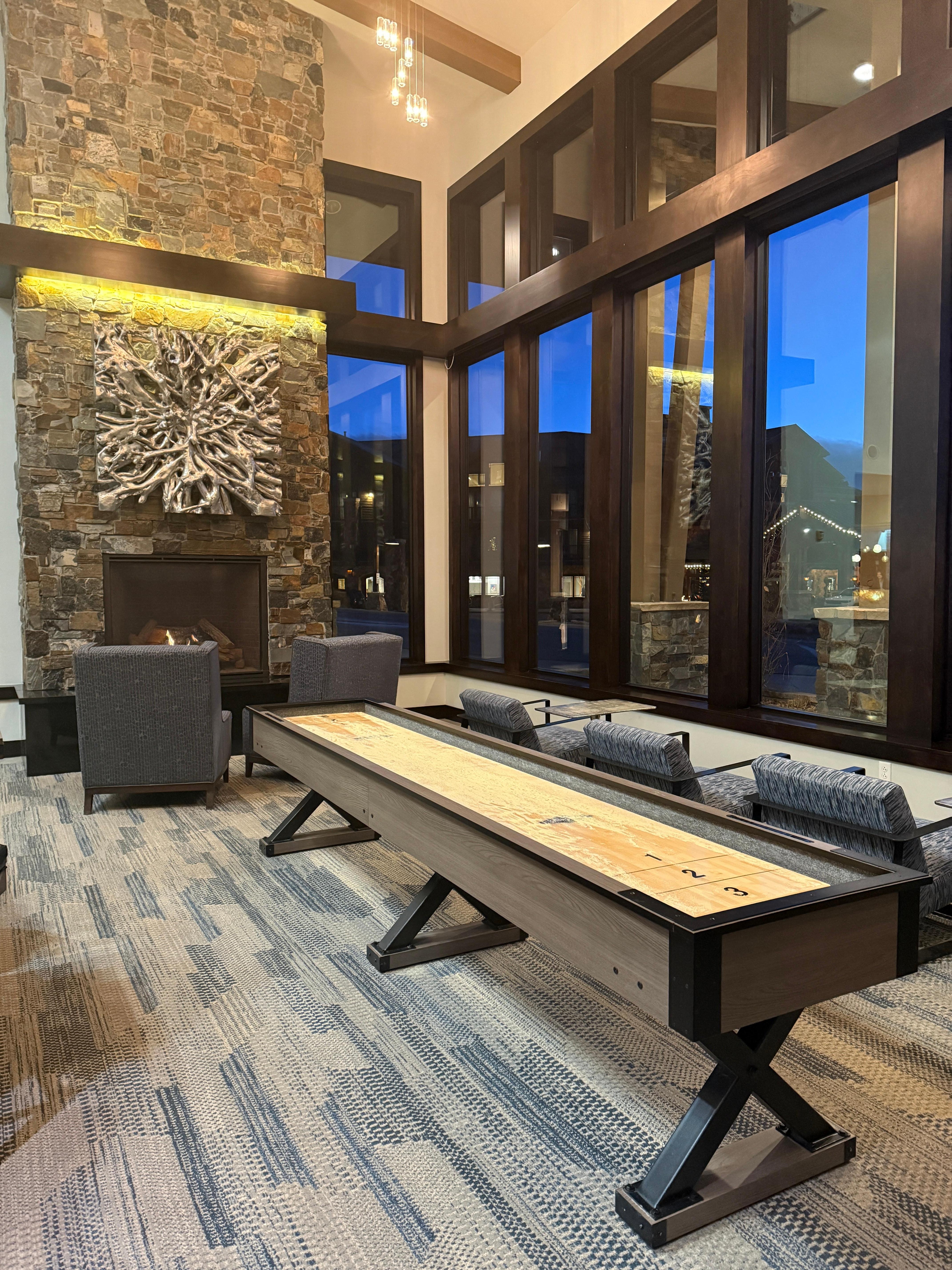 Lobby area with two fireplaces and shuffle board