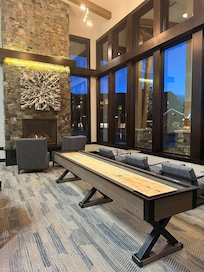 Lobby area with two fireplaces and shuffle board