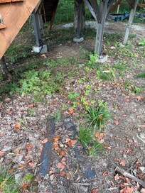 backyard construction - metal scraps by play structure