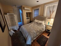 Cozy bedroom with comfy bed.