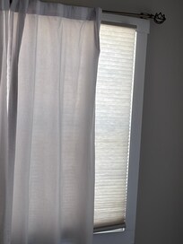 more broken blinds and dirty curtains