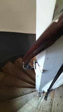 Generally rather shabby looking. Someone had stuck some rubbish in the space between the walk and the fitting for the railing.