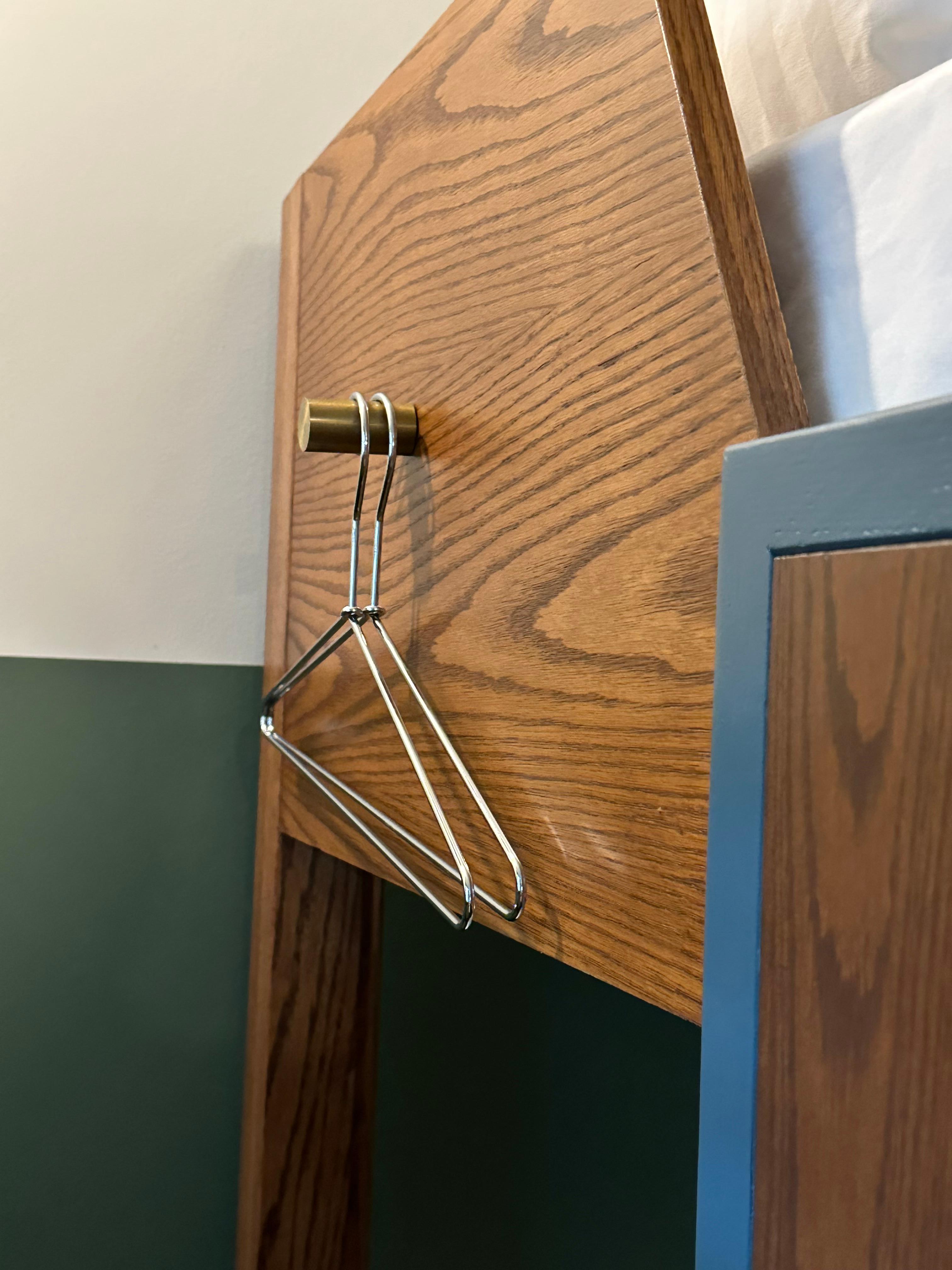 Clothing easily knocked off as there is no way to stop the hangers as post is smooth with no stop at the end.