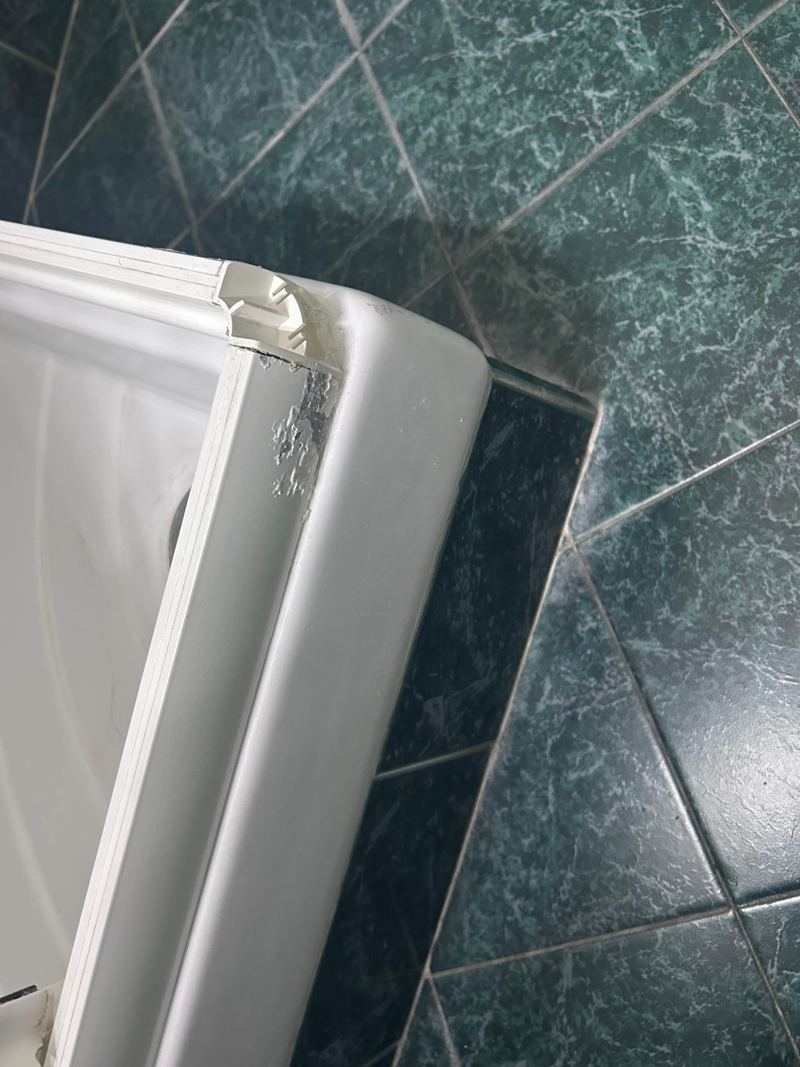 Broken corner of shower base